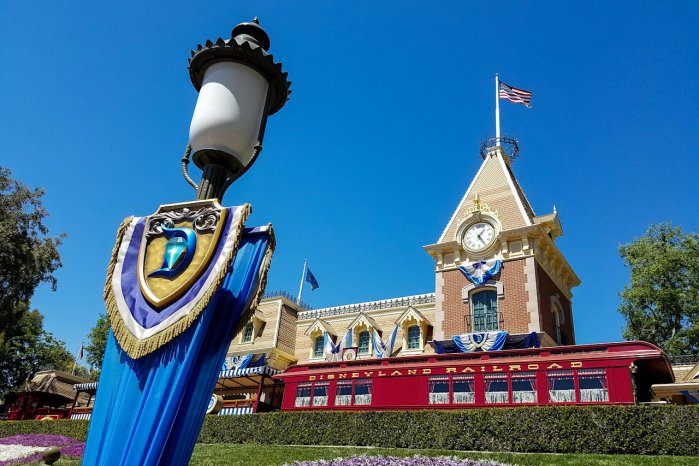 A photo of the Front Entrance Area of Disneyland with the Main Street Train Station on our Guest Traffic Slow Down Page