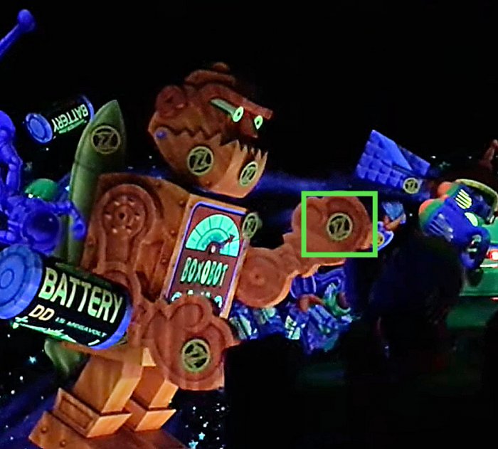 The Buzz Lightyear's Space Ranger Spin Secret Target on the orange red robot's arm
